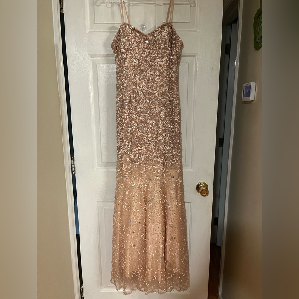 Peach/Pink Milano Formals Prom dress covered in silver sparkles and gems.